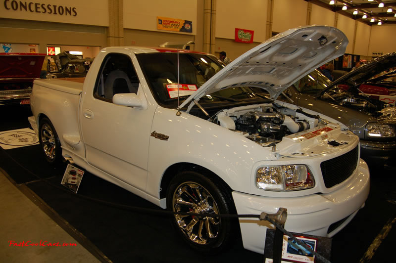 The 2009 World of Wheels Show in Chattanooga, Tennessee. On Jan. 9th,10, & 11th, Pictures by Ron Landry. White Ford Lighting, supercharged V-8 power.