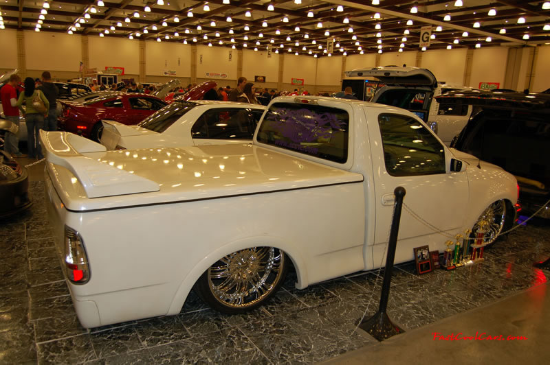 The 2009 World of Wheels Show in Chattanooga, Tennessee. On Jan. 9th,10, & 11th, Pictures by Ron Landry. Low Rider, can you say low, what a whip those are some pimpin wheels too.