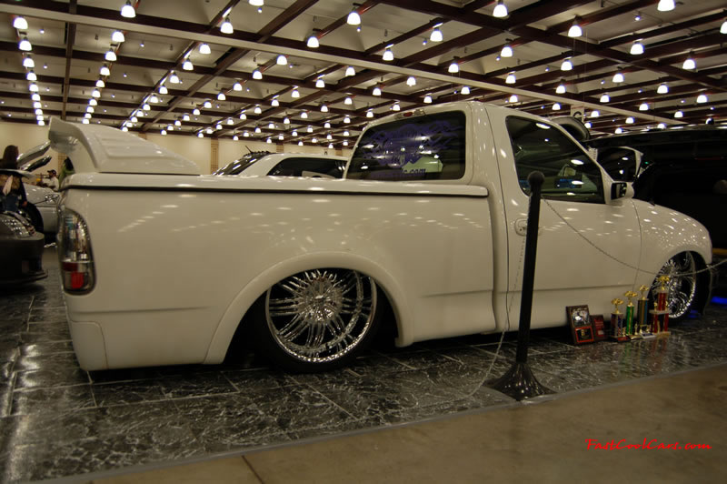 The 2009 World of Wheels Show in Chattanooga, Tennessee. On Jan. 9th,10, & 11th, Pictures by Ron Landry. Custom low truck, with rear spoiler too. Large chrome rims. Bling