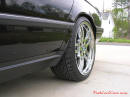 1994 BMW 740iL with chrome 19 inch M-Parallel wheels, 275/30/19 ZR rear tires.
