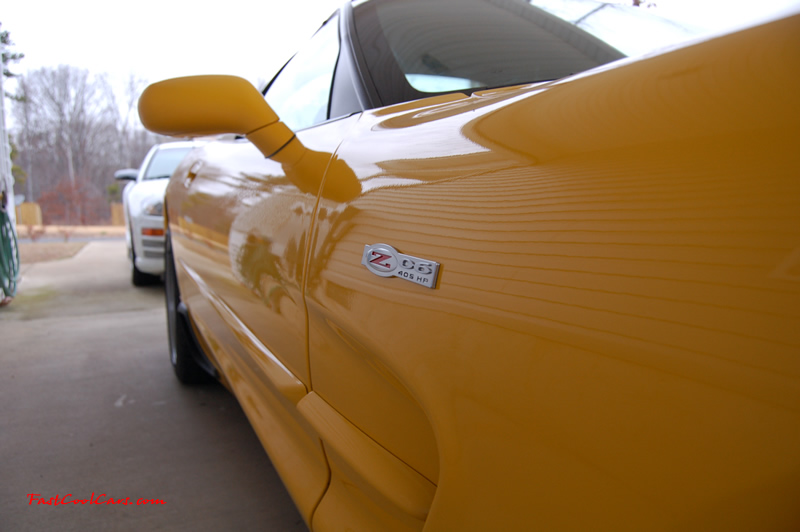 2002 Millennium Yellow Z06 Corvette - 405 HP Stock, at new home in Cleveland, Tennessee, Z06 405 HP logo emblem and side is striaght as an arrow, nice shot.
