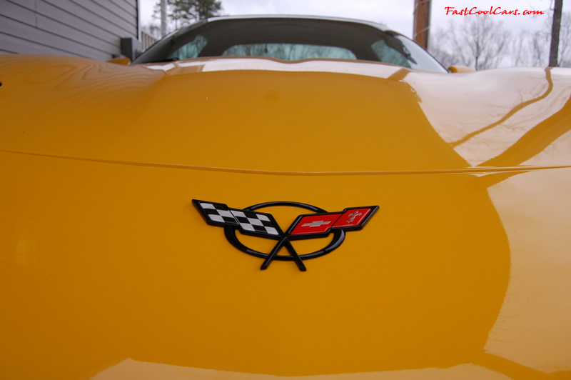 2002 Millennium Yellow Z06 Corvette - 405 HP Stock - C5 logo emblem on front of vette.