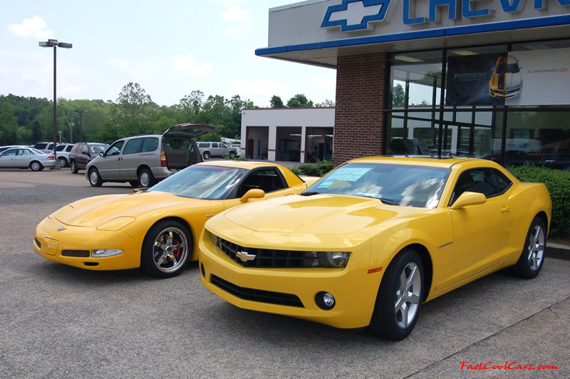 2010 Chevrolet Camaro 2LT and 2002 Supercharged Z06 Corvette, both in yellow.