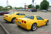 2010 Chevrolet Camaro 2LT and a 2002 supercharged Z06 Corvette, both in Yellow.