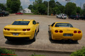 2010 Chevrolet Camaro 2LT and a 2002 supercharged Z06 Corvette, both in Yellow.