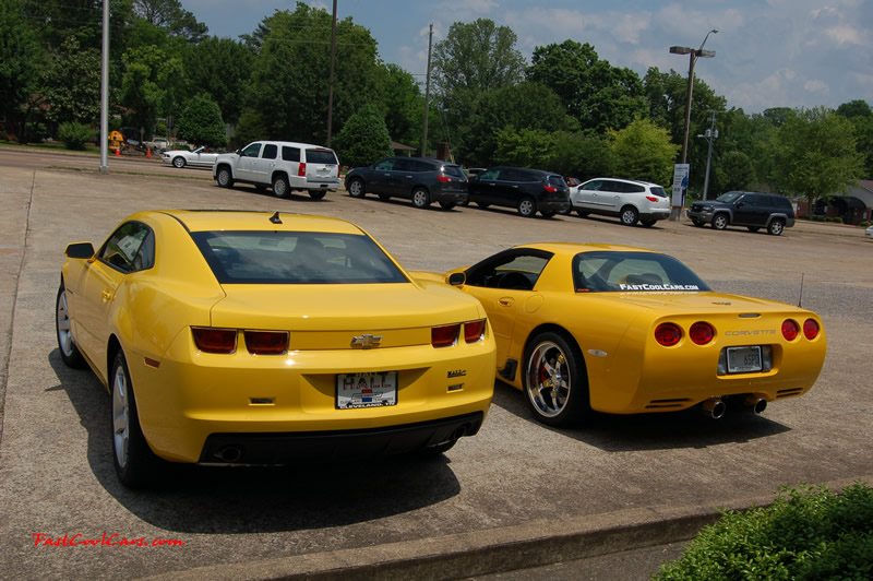 2010 Chevrolet Camaro 2LT and 2002 Supercharged Z06 Corvette, both in yellow.