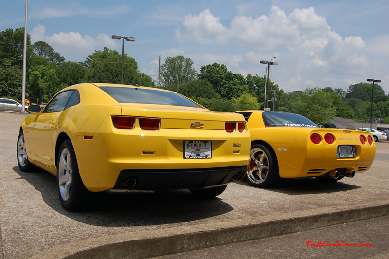 2010 Chevrolet Camaro 2LT and 2002 Supercharged Z06 Corvette, both in yellow.