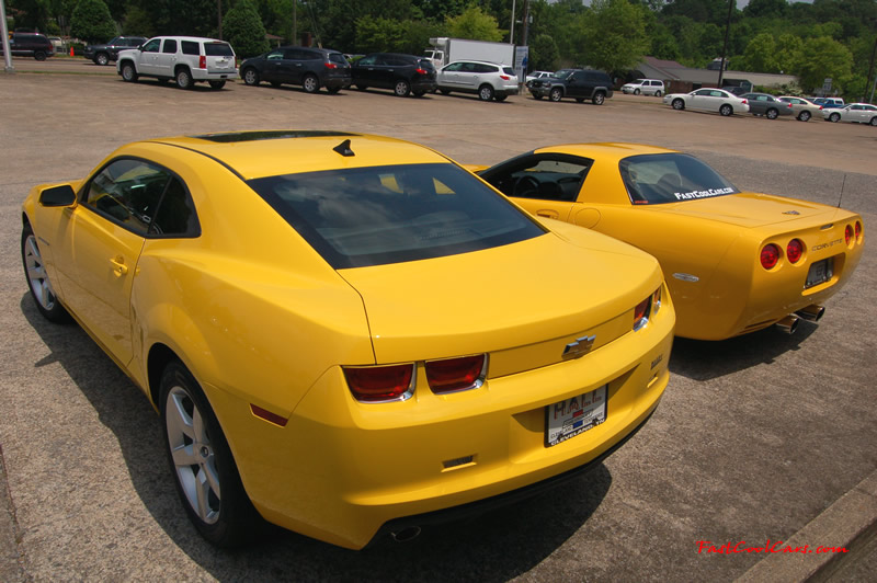 2010 Chevrolet Camaro 2LT and 2002 Supercharged Z06 Corvette, both in yellow.