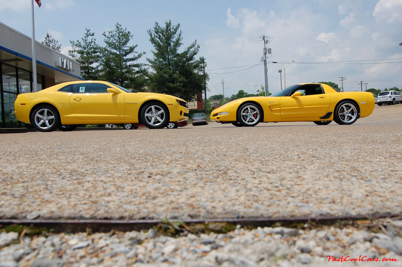 2010 Chevrolet Camaro 2LT and 2002 Supercharged Z06 Corvette, both in yellow.