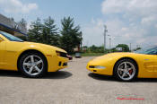 2010 Chevrolet Camaro 2LT and a 2002 supercharged Z06 Corvette, both in Yellow.