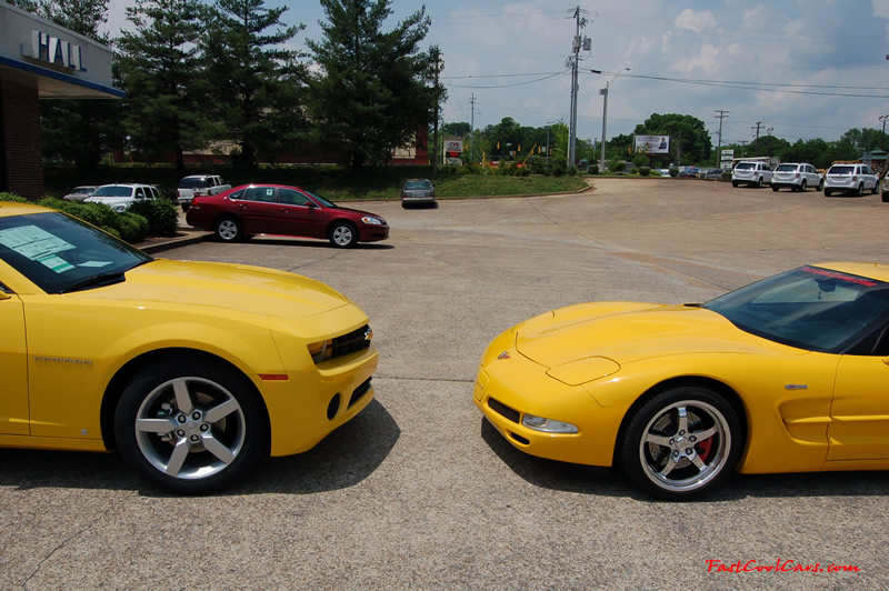 2010 Chevrolet Camaro 2LT and 2002 Supercharged Z06 Corvette, both in yellow.