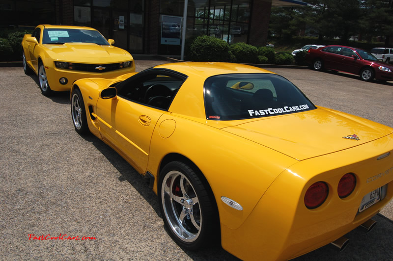 2010 Chevrolet Camaro 2LT and 2002 Supercharged Z06 Corvette, both in yellow.