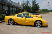 2010 Chevrolet Camaro 2LT and a 2002 supercharged Z06 Corvette, both in Yellow.