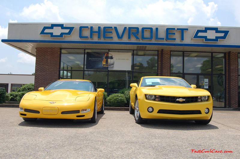 2010 Chevrolet Camaro 2LT and 2002 Supercharged Z06 Corvette, both in yellow.