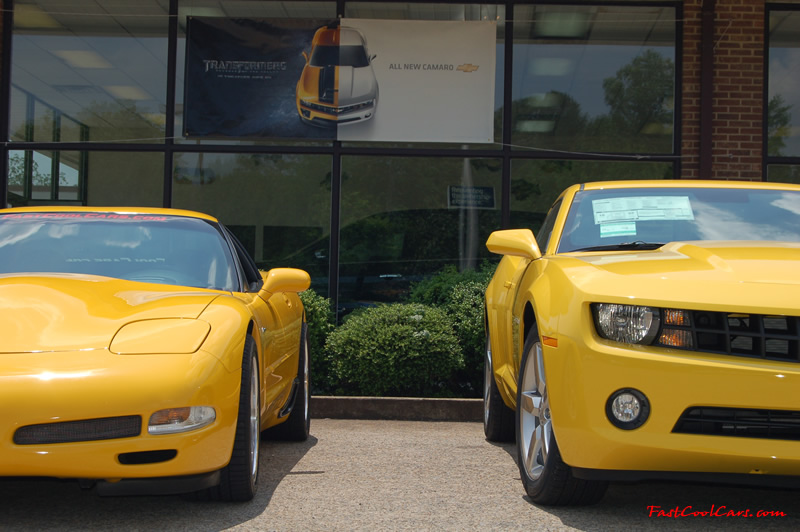 2010 Chevrolet Camaro 2LT and 2002 Supercharged Z06 Corvette, both in yellow.