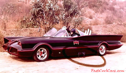 The Original Batmobile from the series in 1966-68 TV series, Batmans cape is hanging out of the door.