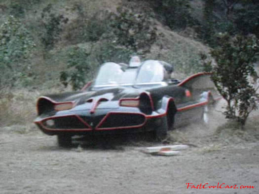 The Original Batmobile from the series in 1966-68 TV series, coming out of the bat cave area.