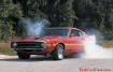 1970 Ford Shelby GT500 doing burnout.