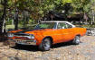 1970 Plymouth Road Runner - It is Tor-Red exterior, with a white vinyl top and interior