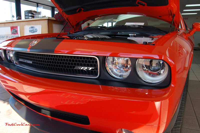 2009 Dodge Challenger SRT8 - 6.1 Hemi with 425HP, and this one is a 6 speed cool front end and headlights too.