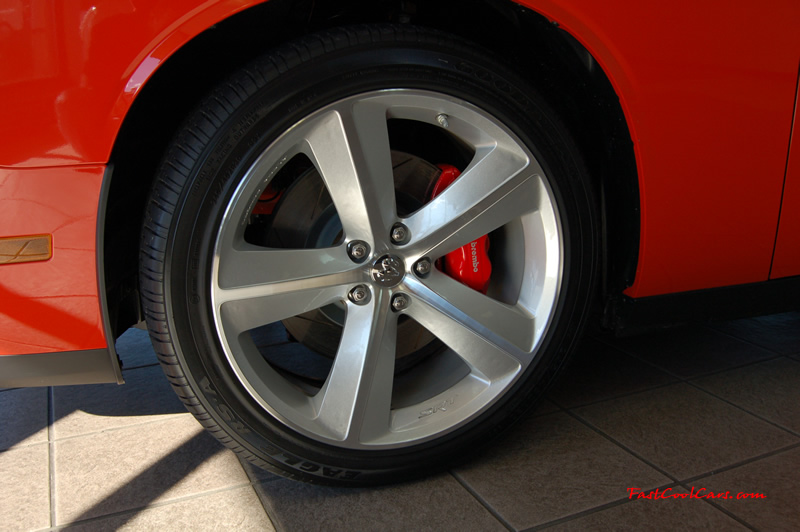 2009 Dodge Challenger SRT8 - 6.1 Hemi with 425HP, and this one is a 6 speed Nice rims, I like them better then the chrome version ones too.