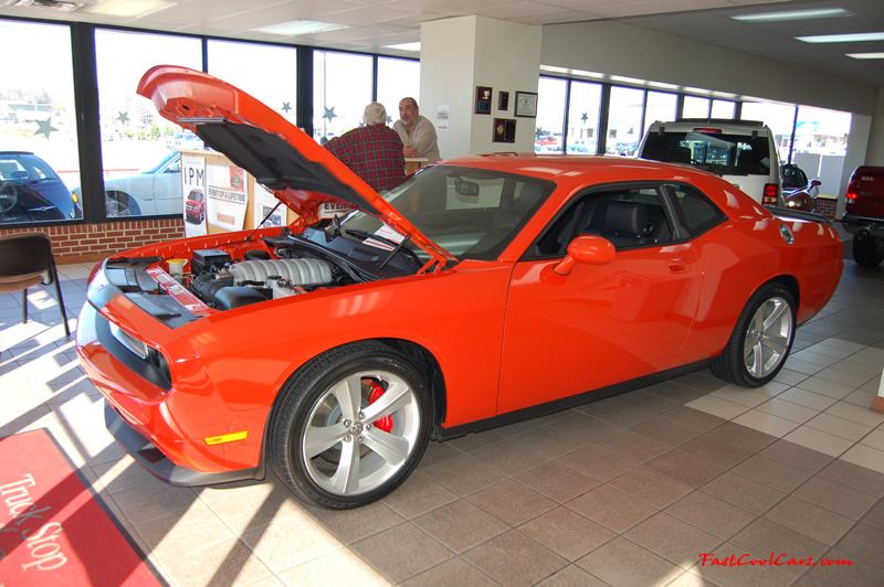 2009 Dodge Challenger SRT8 - 6.1 Hemi with 425HP, and this one is a 6 speed The General Lee orange color is nice.