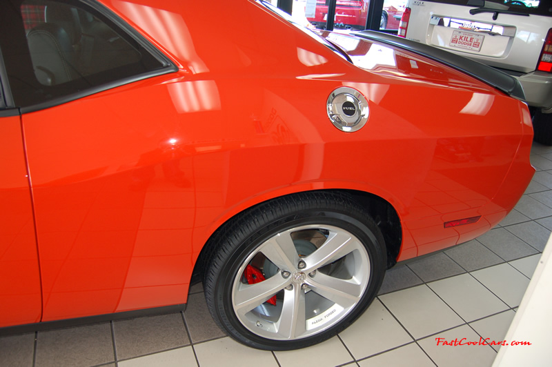 2009 Dodge Challenger SRT8 - 6.1 Hemi with 425HP, and this one is a 6 speed The big brake set up is an awesome addition to the whole package.