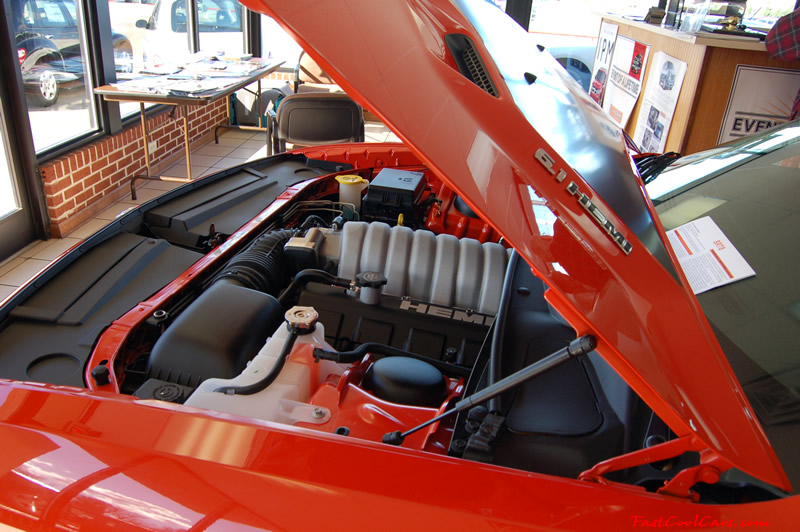 2009 Dodge Challenger SRT8 - 6.1 Hemi with 425HP, and this one is a 6 speed I like the 6.1 HEMI emblems on the hood.