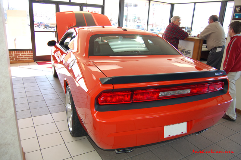 2009 Dodge Challenger SRT8 - 6.1 Hemi with 425HP, and this one is a 6 speed nice rear spoiler with the SRT8 on it as well.