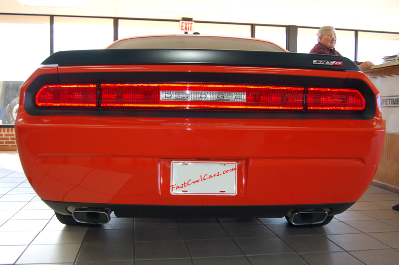 2009 Dodge Challenger SRT8 - 6.1 Hemi with 425HP, and this one is a 6 speed A very nice looking rear end for sure. Love the dual exhaust and tips too.