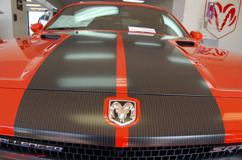 2009 Dodge Challenger SRT8 - 6.1 Hemi with 425HP, and this one is a 6 speed I like the carbon fiber look in the stripes.