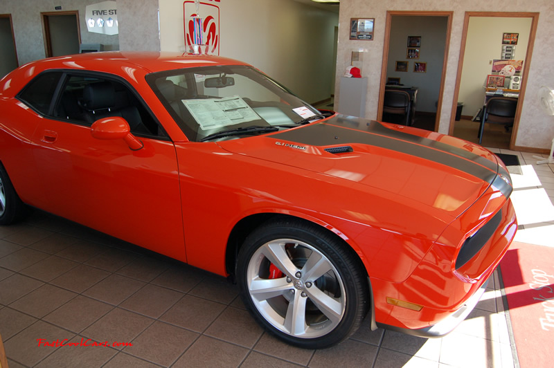 2009 Dodge Challenger SRT8 - 6.1 Hemi with 425HP, and this one is a 6 speed Great looking car from the side view too.