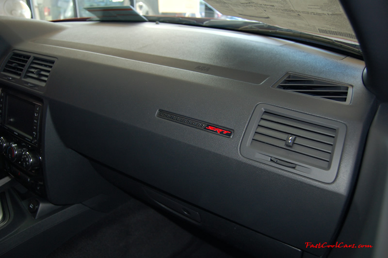 2009 Dodge Challenger SRT8 - 6.1 Hemi with 425HP, and this one is a 6 speed, special dash tag denoting the "SRT8" edition.