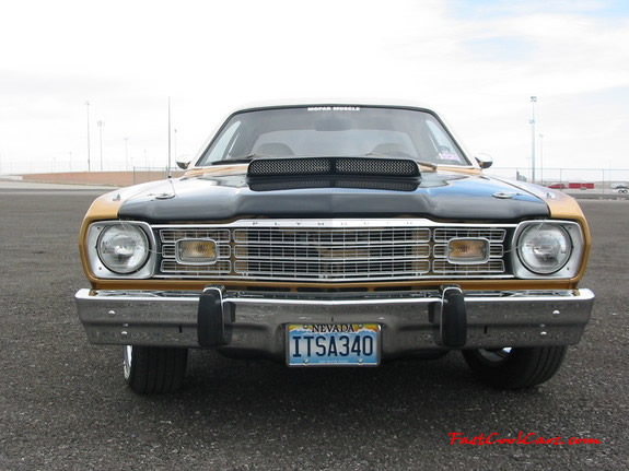1973 Plymouth Duster 340, custom chrome mag wheels.