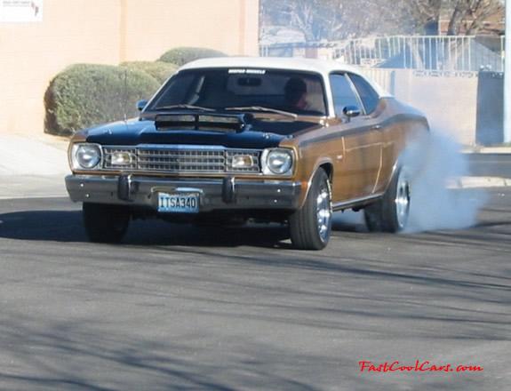 1973 Plymouth Duster 340, custom chrome mag wheels.