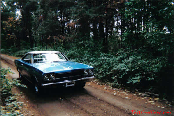 1969 Plymouth Satellite Mod top car. As you can see, it is a beauty. It sits in 4 chrome Magnum 500 wheels mounted on BF Goodrich TA's.
