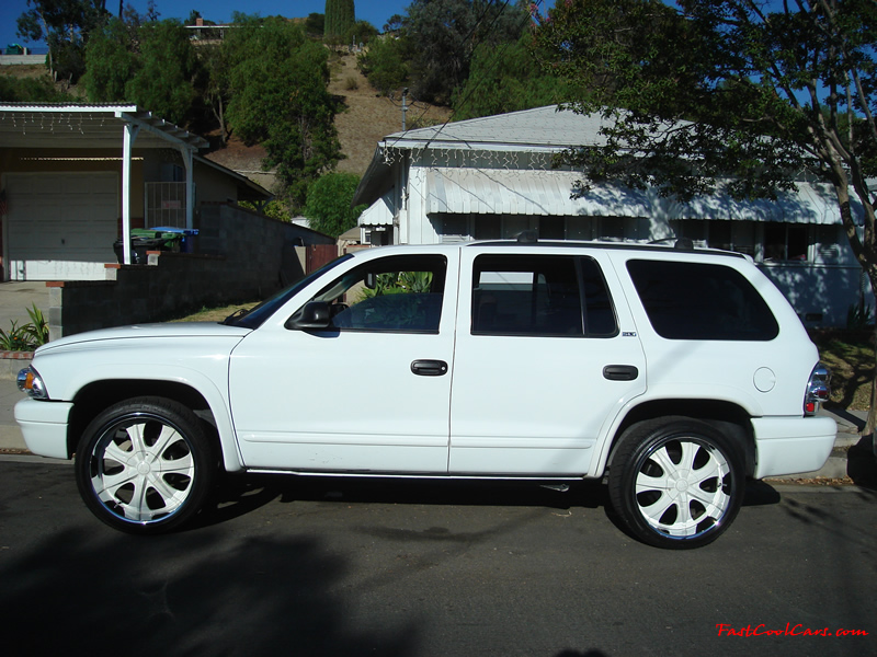 2002 Dodge Durango SLT 4.7 White w/white powder coated rims Third row seat, Roof Rack, tinted windows, 22" velocity white rims, 5" chrome lip, lexani tires, Brand new Gabriel Shocks all around