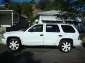 2002 Dodge Durango SLT 4.7 White w/white powder coated rims Third row seat, Roof Rack, tinted windows, 22" velocity white rims, 5" chrome lip, lexani tires, Brand new Gabriel Shocks all around