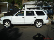 2002 Dodge Durango SLT 4.7 White w/white powder coated rims Third row seat, Roof Rack, tinted windows, 22" velocity white rims, 5" chrome lip, lexani tires, Brand new Gabriel Shocks all around