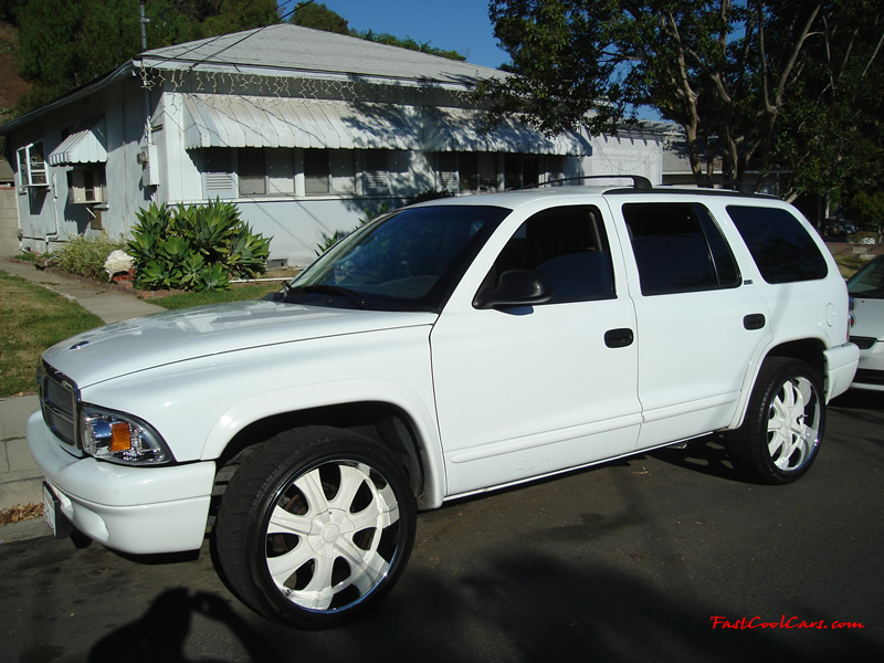 2002 Dodge Durango SLT 4.7 White w/white powder coated rims Third row seat, Roof Rack, tinted windows, 22" velocity white rims, 5" chrome lip, lexani tires, Brand new Gabriel Shocks all around