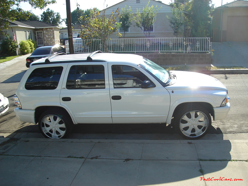 2002 Dodge Durango SLT 4.7 White w/white powder coated rims Third row seat, Roof Rack, tinted windows, 22" velocity white rims, 5" chrome lip, lexani tires, Brand new Gabriel Shocks all around