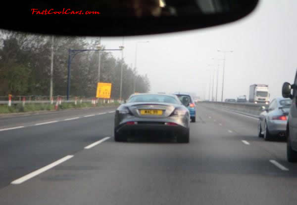 Very Fast Cool Exotic Supercar traveling down the highway.