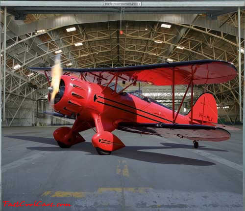 Bi-plane in hanger, on garage door decal.