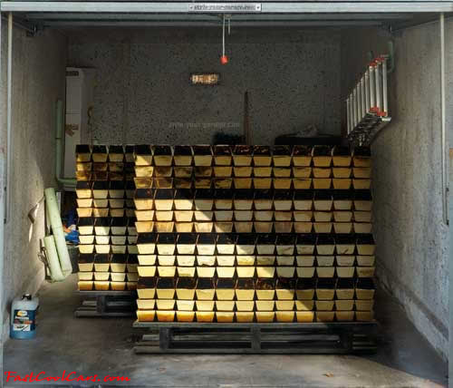 Two pallets of gold bars, on garage door decal.