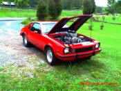 Supercharged dual quad V8 Chevy Monza.