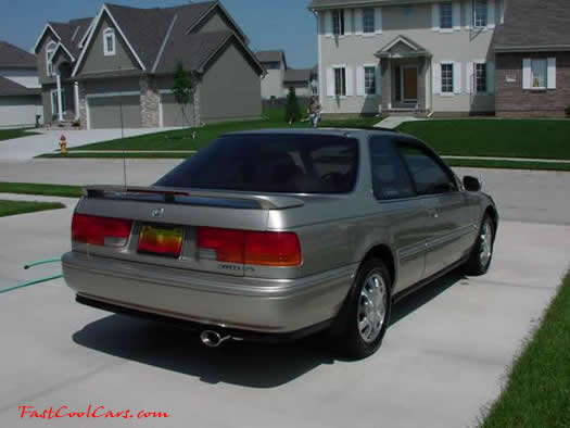 1993 Gold Honda Accord SE rear view, check out the cool stock 'SE' spoiler.