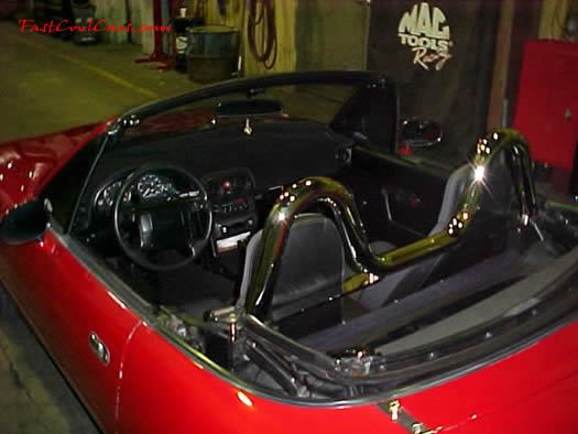 1990 Mazda Miata Roadster - Check out the chrome roll bar, 5 speed, little red sports car.