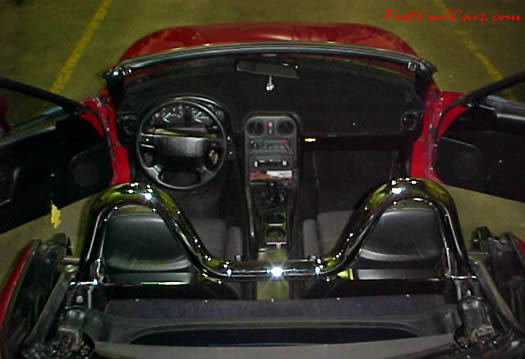 1990 Mazda Miata Roadster - check out the chrome roll bar, 5 speed, little red sports car.