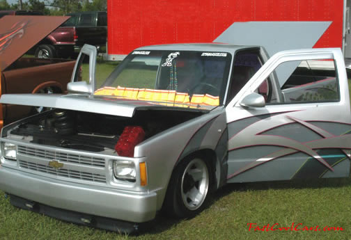 Lowriders that have been lowered, dropped, slammed, and scraping.