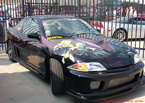 Lowriders that have been lowered, dropped, slammed, and scraping. Nice paint work on the car.